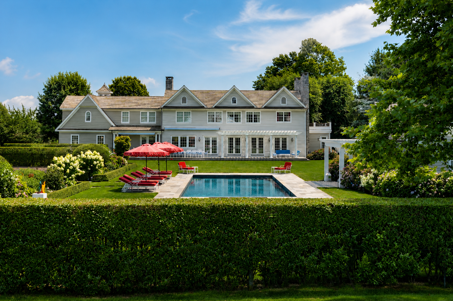 Poolside view of a Hamptons property