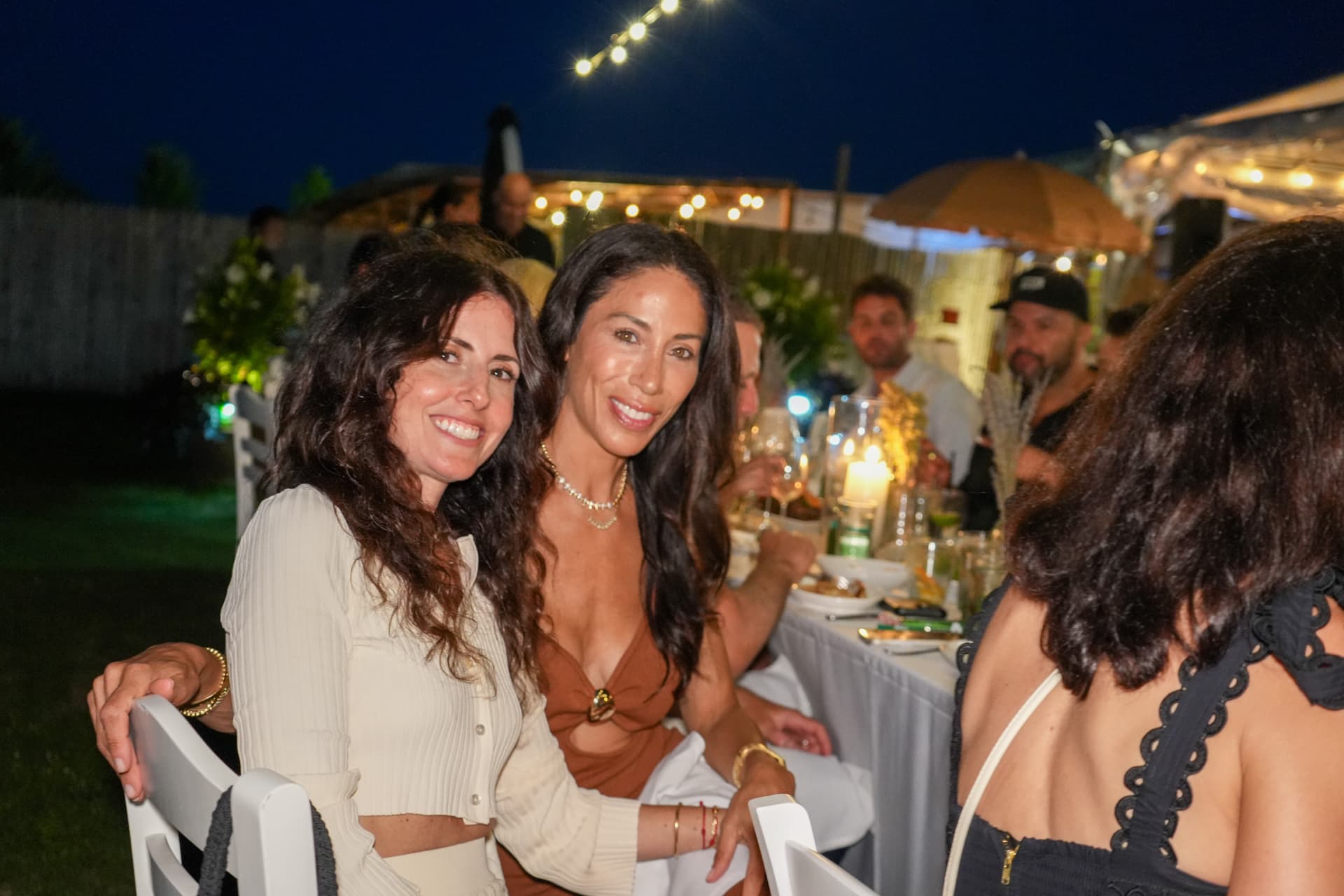 Guests enjoying the evening at the candlelit dinner table