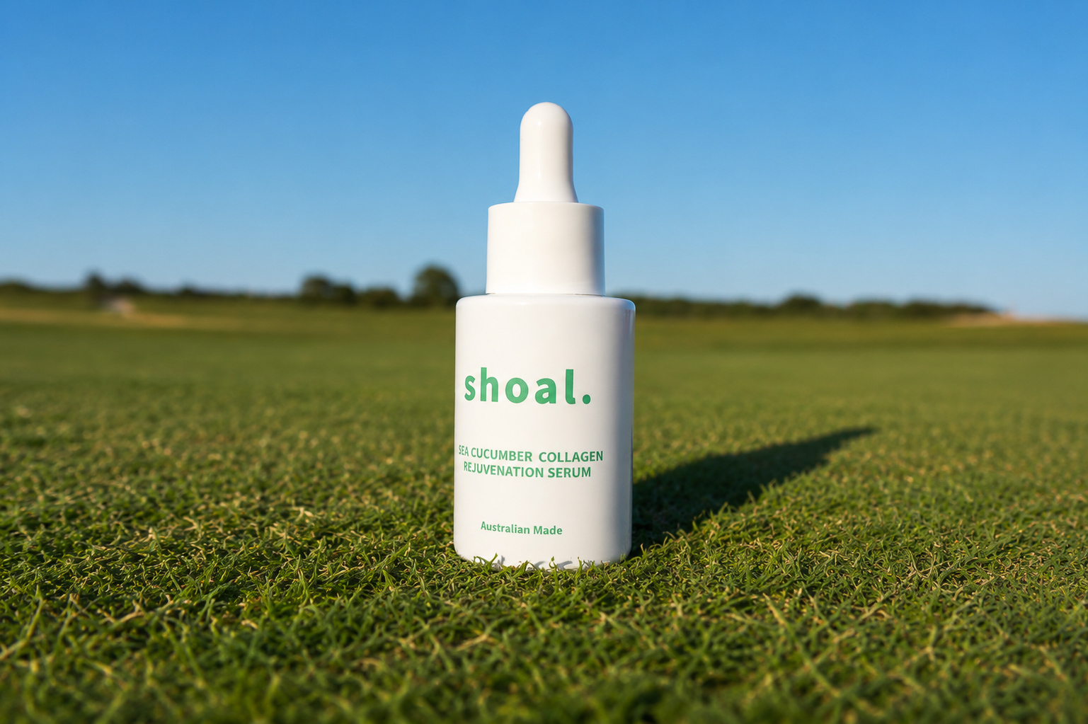 Shoal sea cucumber collagen serum standing on manicured grass in bright sun