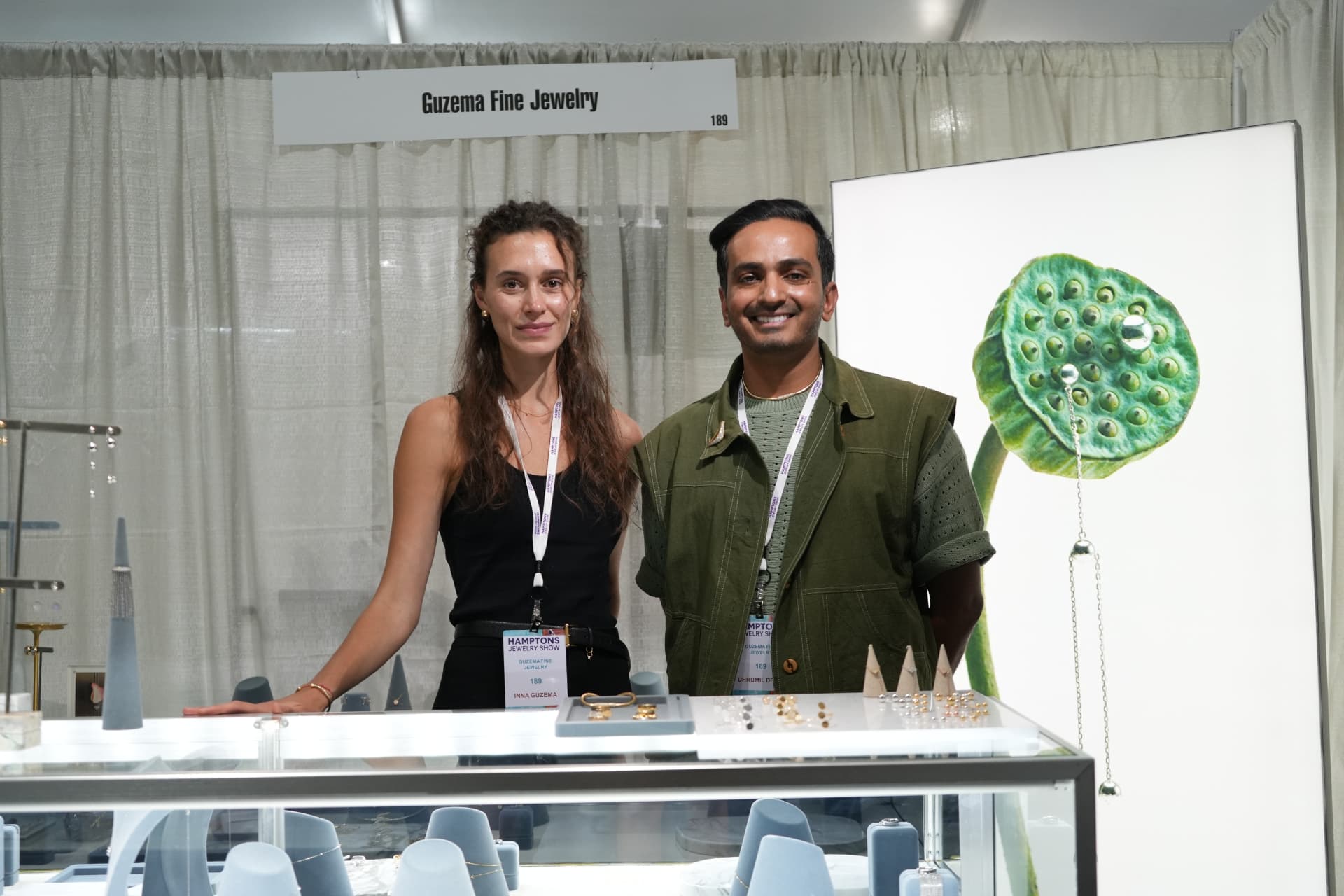 The Guzema Fine Jewelry team at their lit display case during the Hamptons Jewelry Show