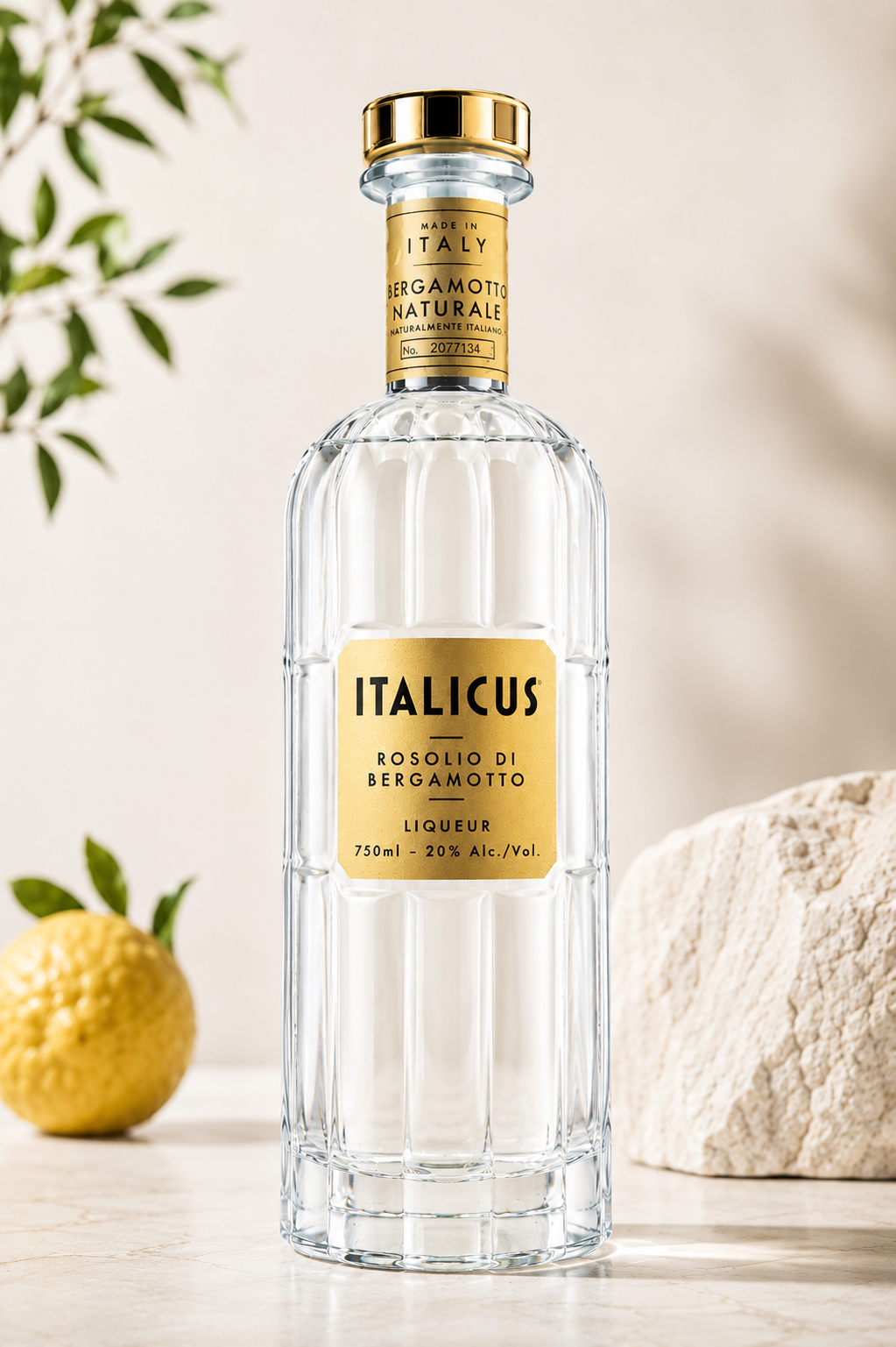 Italicus Rosolio di Bergamotto bottle in soft daylight with lemon and stone
