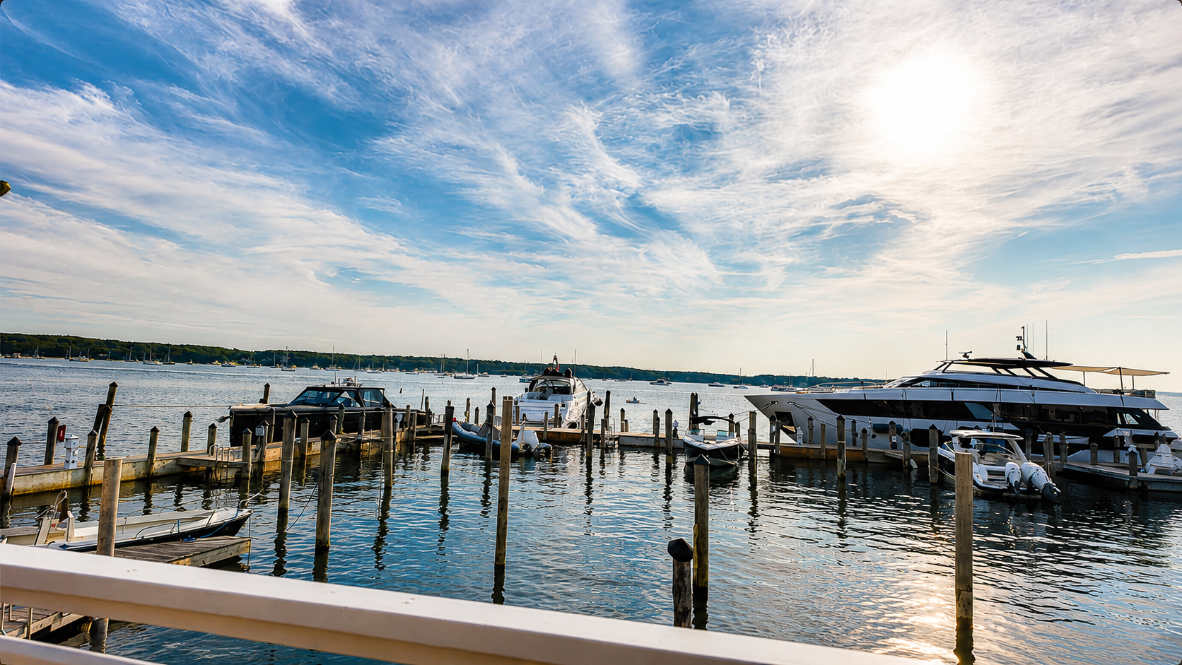 Yachts docked at EHP Resort & Marina under a wide summer sky