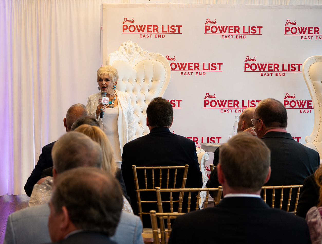 Speaker addressing the room from the Dan's Power List stage as guests listen
