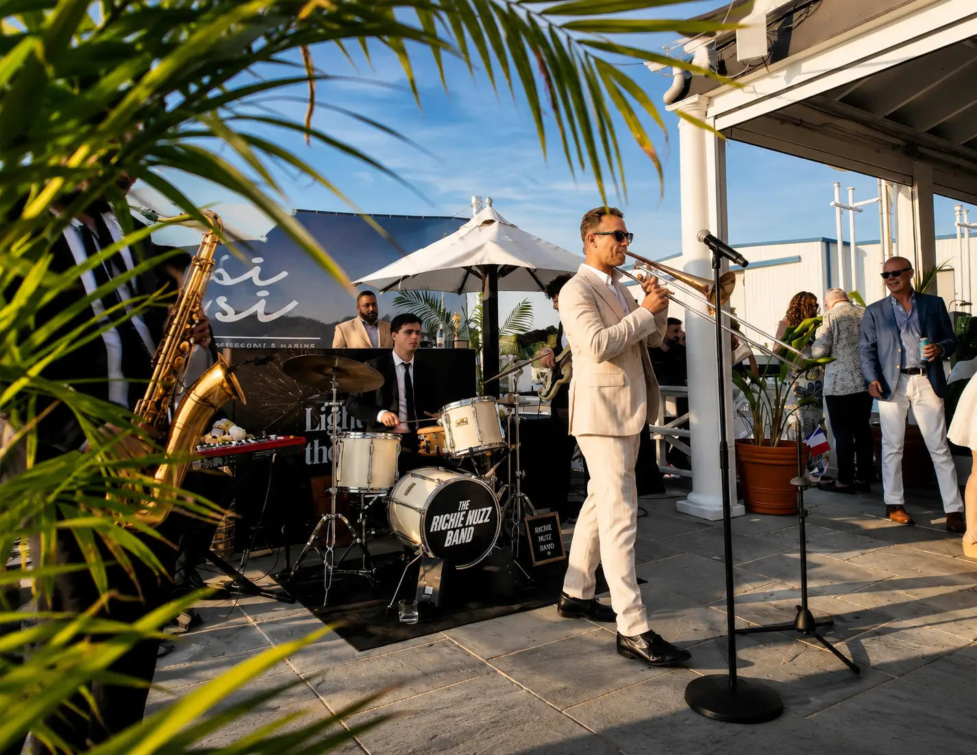 The Richie Nuzz Band performing on the terrace as guests look on