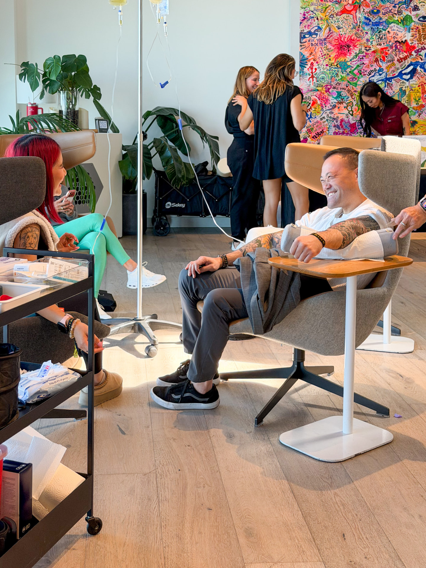 Attendee receiving a wellness treatment at BioHack SF
