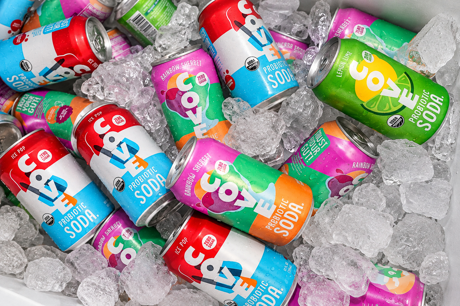 Colorful probiotic soda cans chilled on ice