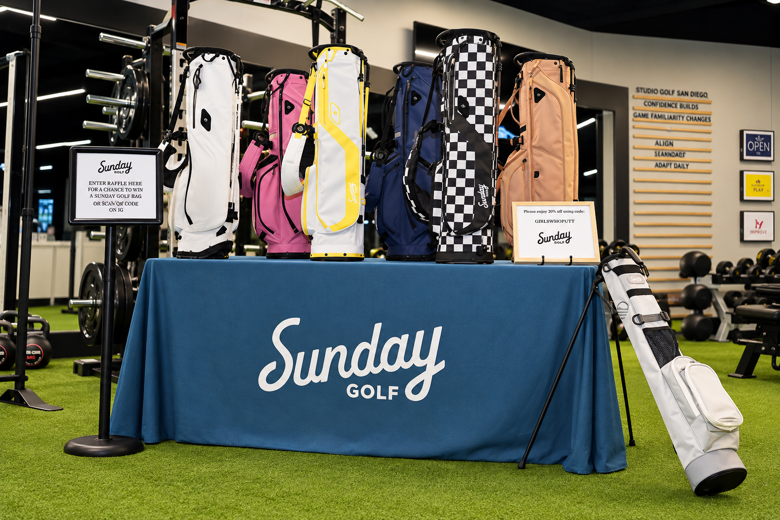 Golf bags displayed at a brand activation inside the event