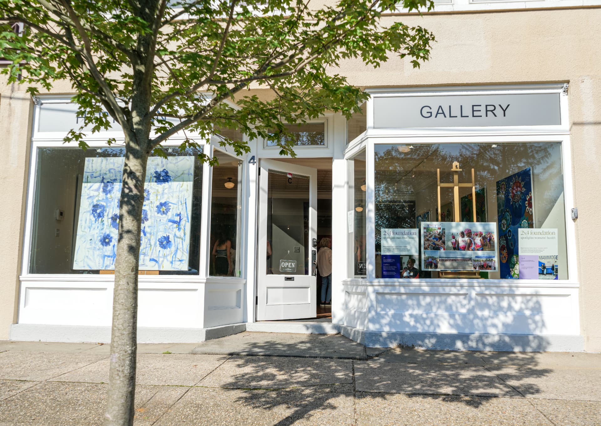 Hartman Gallery storefront in Southampton with open doors and artwork in the windows